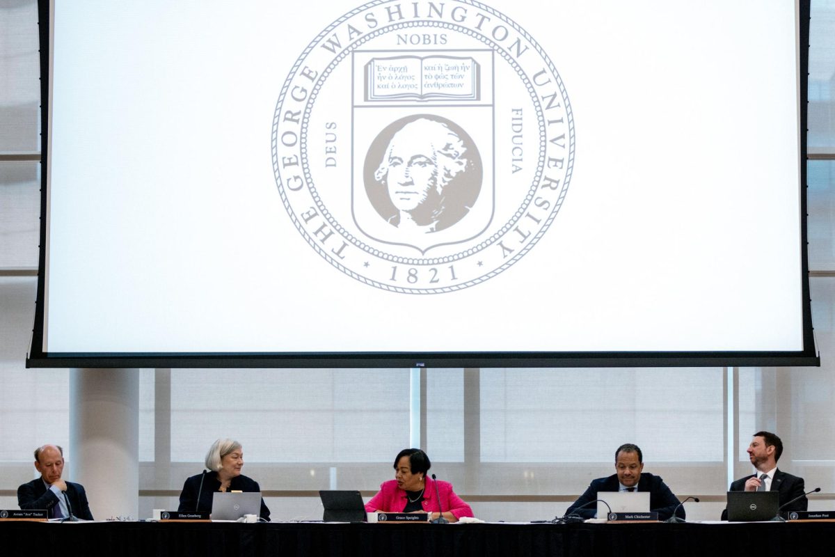 Members of the Board of Trustees sit during a meeting this semester. 
