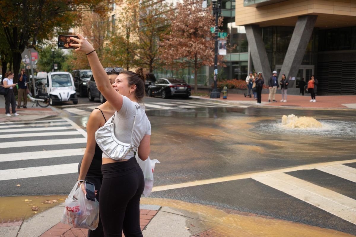 A leaky valve on H Street led to minor flooding and water outages on campus Thursday, which some students decided was worthy of a selfie.