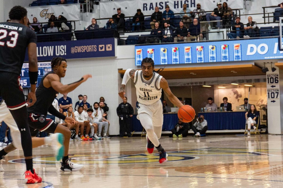 Senior guard James Bishop IV cuts across the court during a game last year.