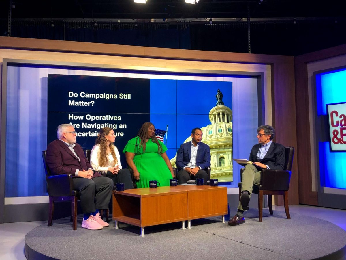 From left to right, Mark Campbell, Lilly Roberson, Maya Rupert, Doug Thornell and Peter Loge in the School of Media and Public Affairs Tuesday.