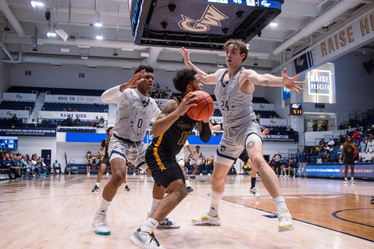 Freshman guard Trey Autry and sophomore guard forward Benny Schröder block a pass during the game against Coppin State. 