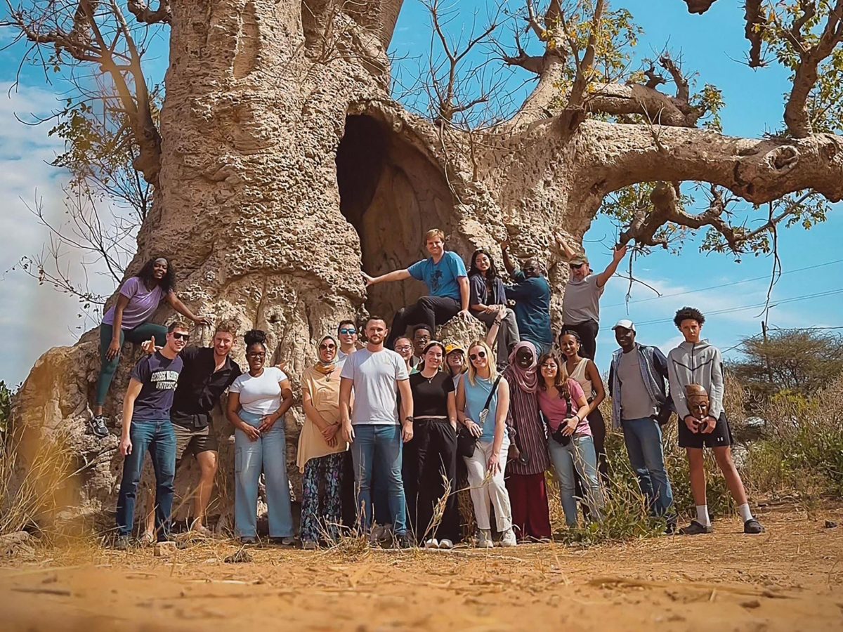Elliott+School+of+International+Affairs+students+pose+at+the+foot+of+a+historic+baobab+tree+during+their+trip+to+Senegal.