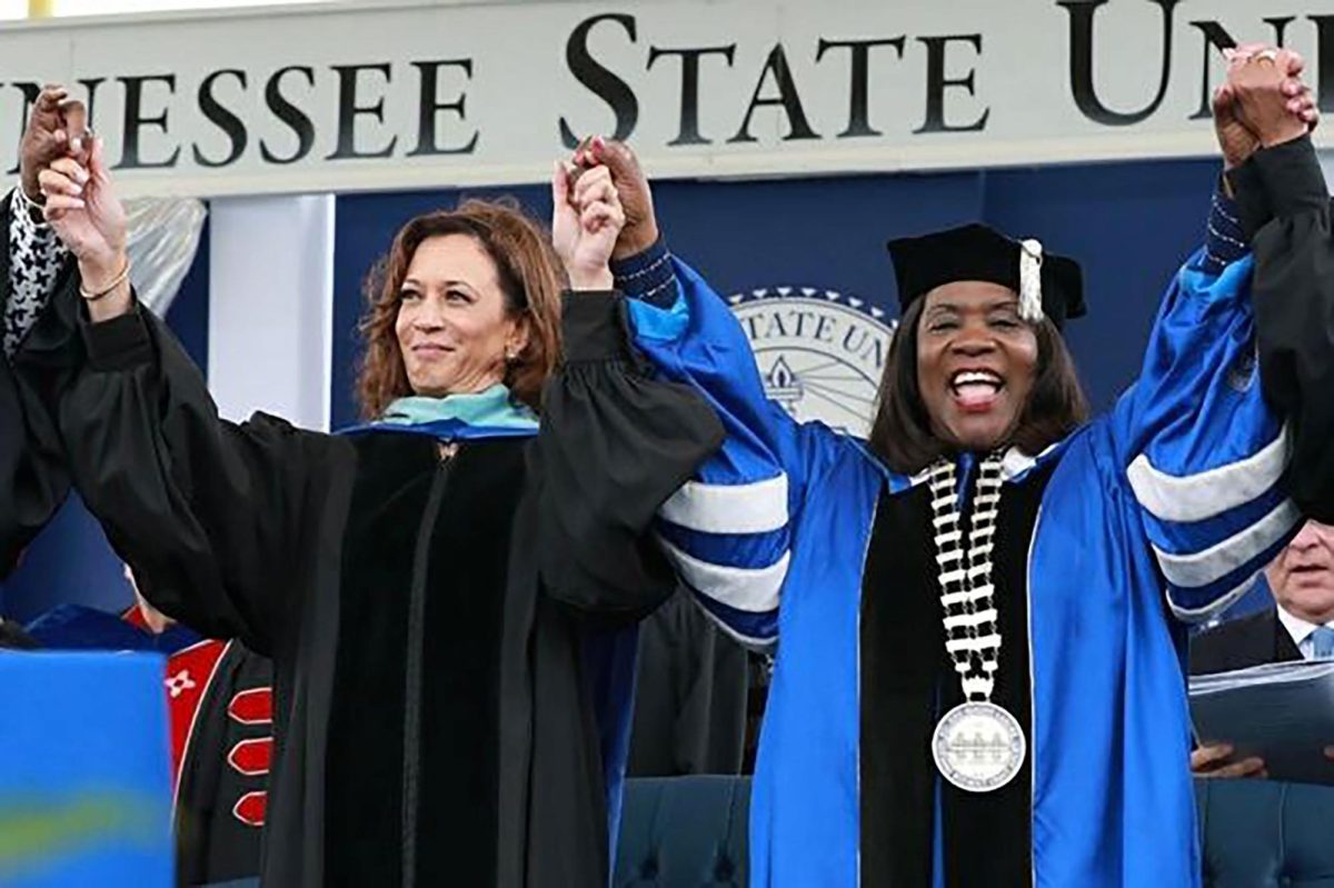 Glenda Baskin Glover joins hands with Vice President Kamala Harris at the TSU Commencement Ceremony in 2022.