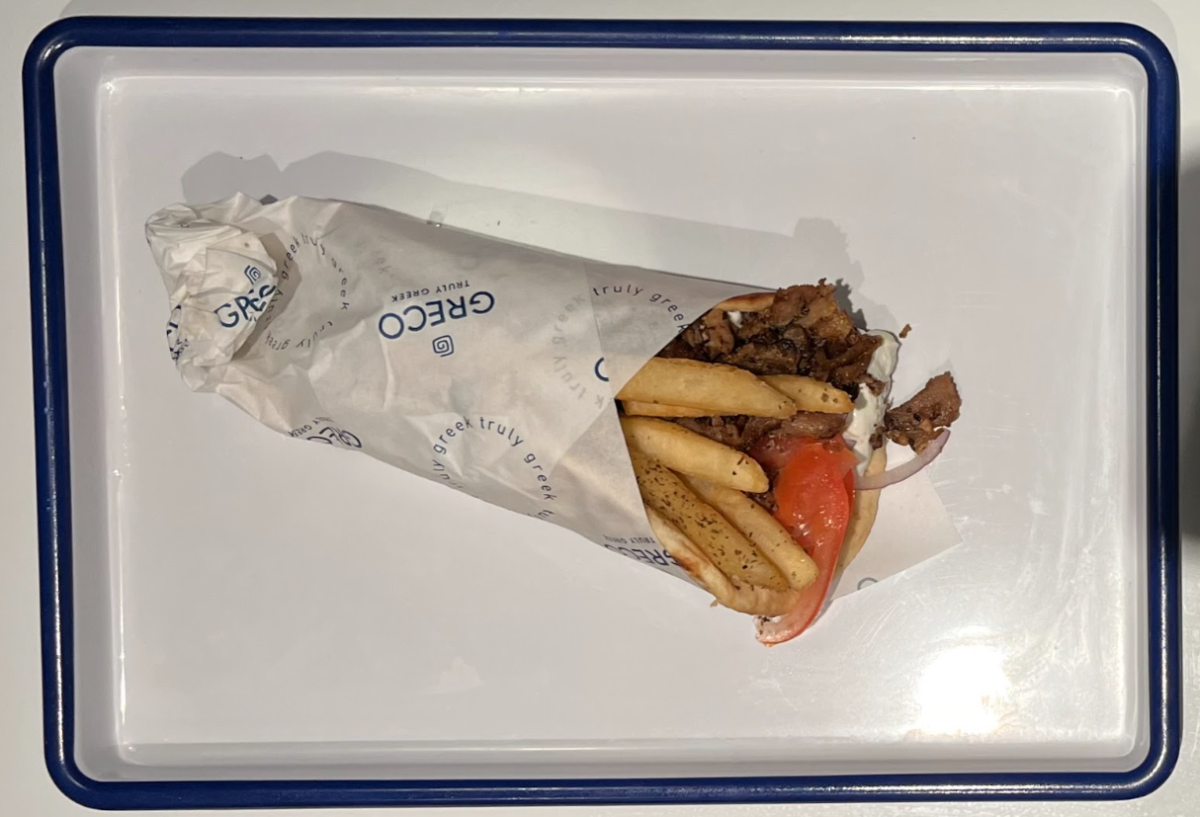 Grecos pork gyro, complete with a thick layer of tzatziki, onions, tomatoes and seasoned fries.