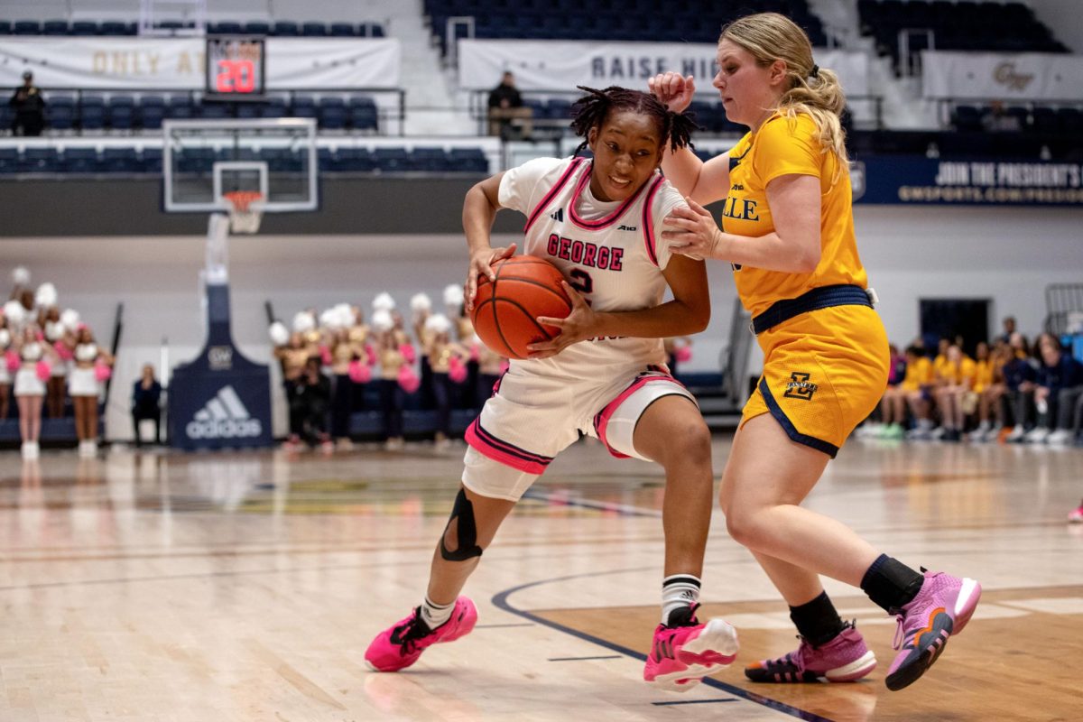 Sophomore guard Nya Robertson defends the ball against La Salle.