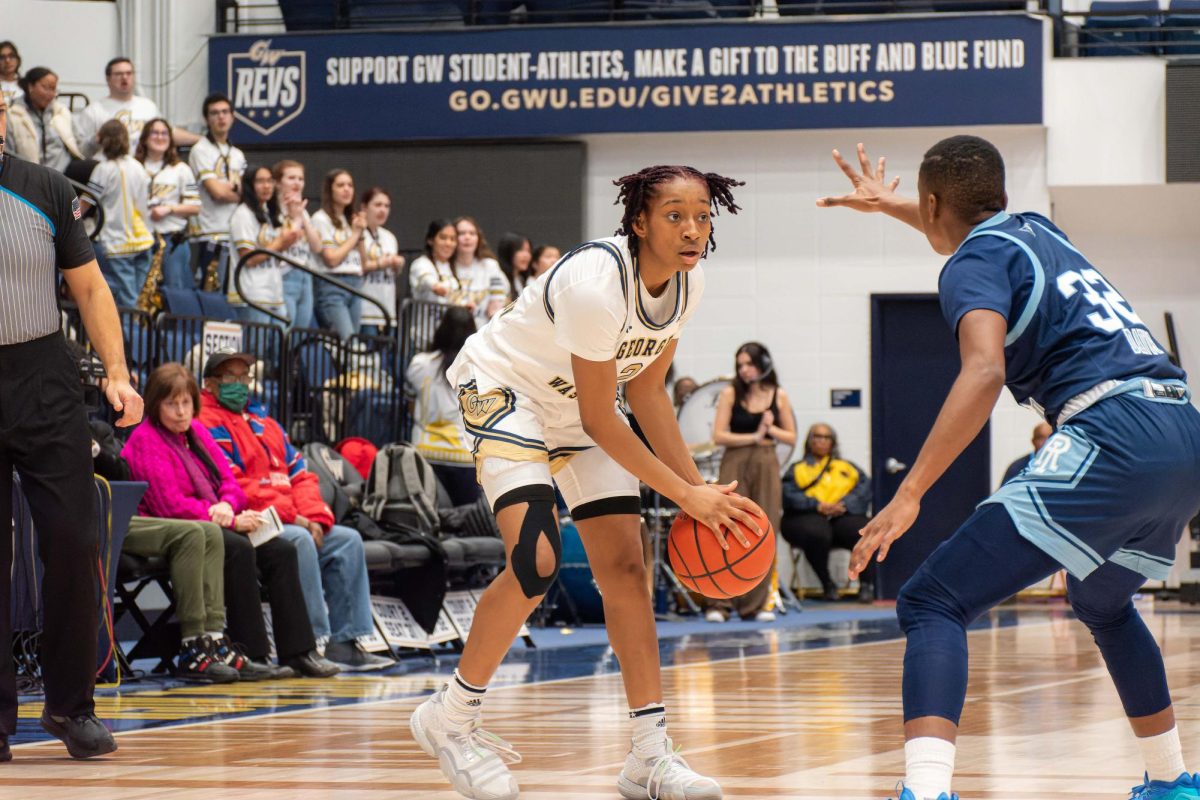 Sophomore guard Nya Robertson defends the ball during a game against URI.