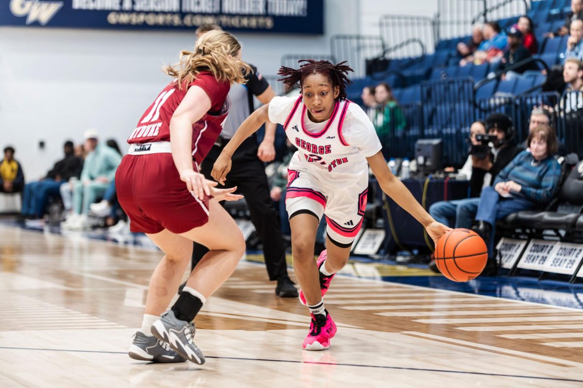 Sophomore guard Nya Robertson drives to the hoop in a game against UMass. 
