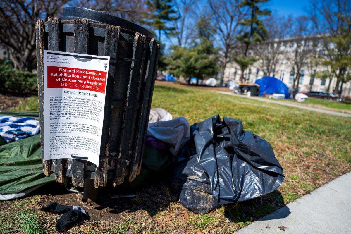 A notice taped to a trash receptacle notifies residents of an incoming encampment cleanup.