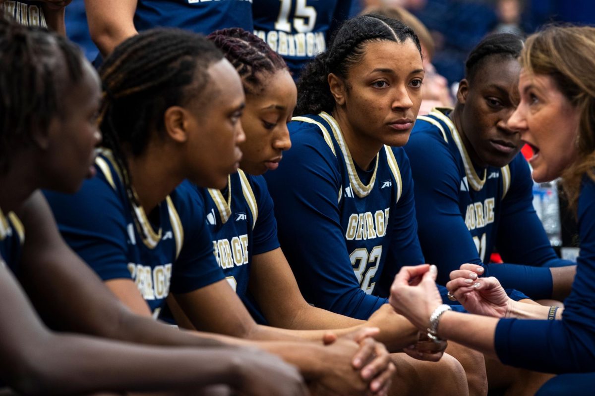 Starters (from left to right) Nya Lok, Asjah Innis, Nya Roberson, Essence Brown and Mayowa Taiwo get lectured during a timeout by Head Coach Caroline McCombs.