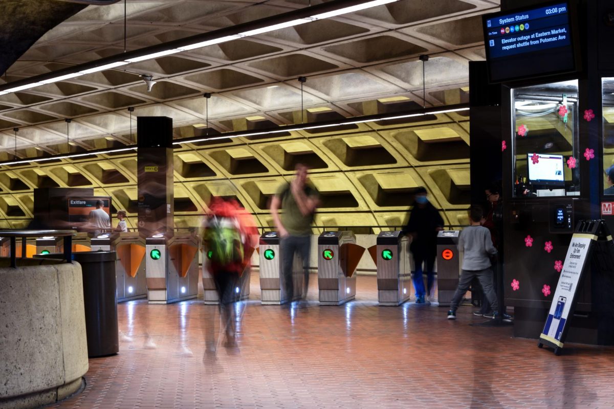 Commuters pass through the Metro faregates at the Foggy Bottom-GWU Metro station.