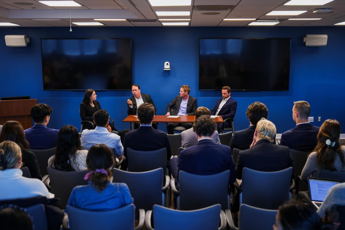 From left to right, Jack Shanahan, Aaron Brown and Aaron Bateman speak during the panel at the Elliott School of International Affairs on Tuesday.
