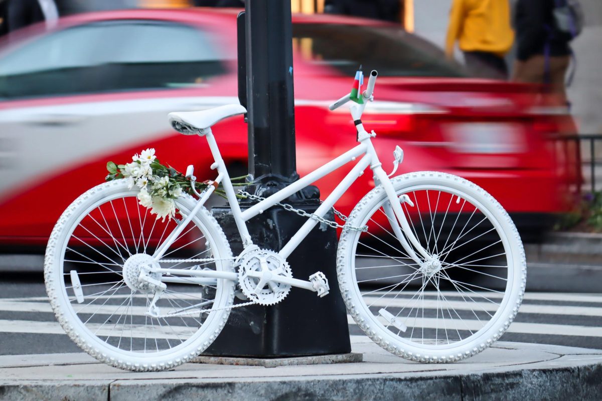 A ghost bike placed at Connecticut Avenue and L Street in honor of GW graduate student Nijad Huseynov, who was struck and killed by the driver of a car in October.