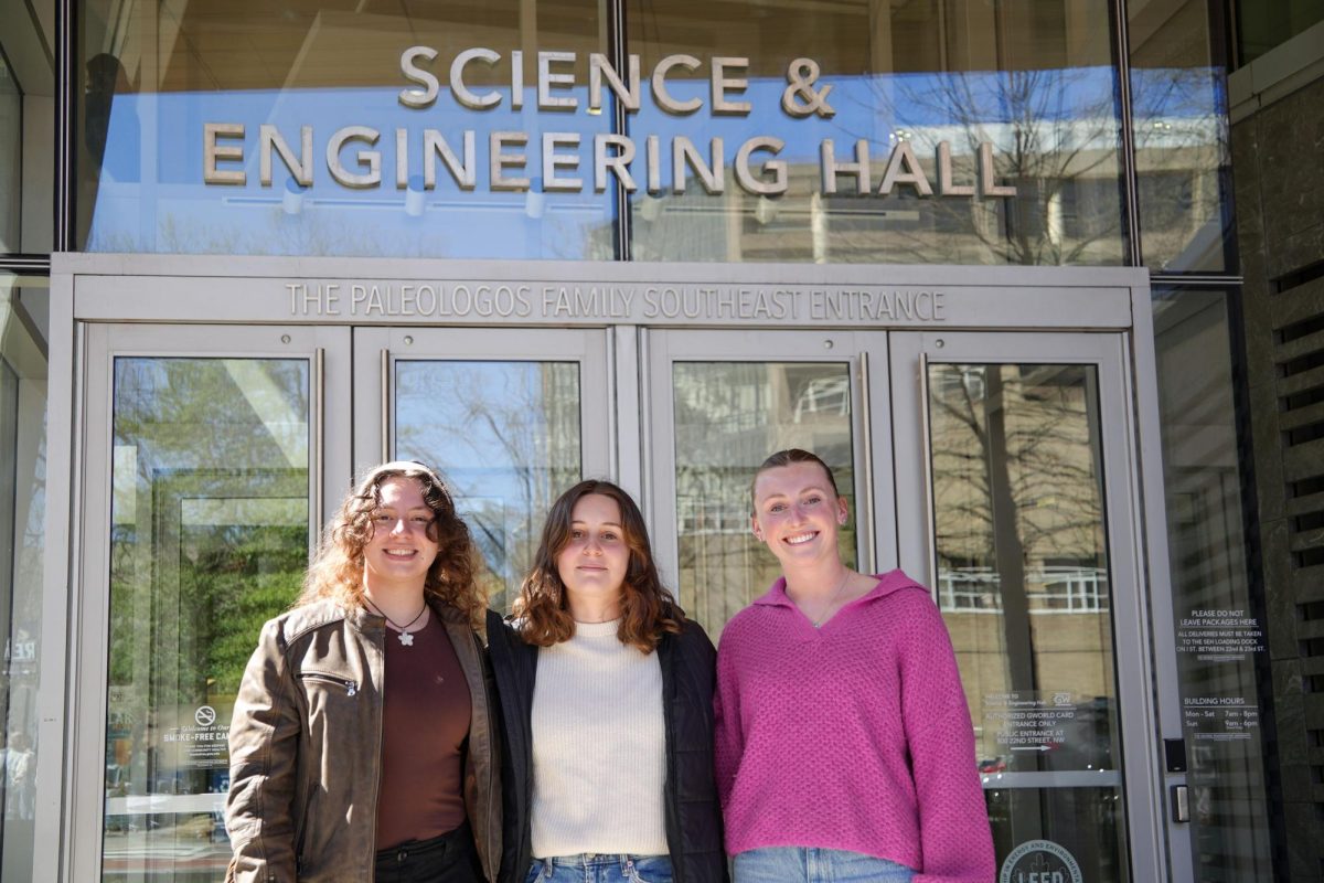 From left to right, GW Engineers Without Borders project leaders Isabella Elmore and Tamar Todd and President Lily Sarnowski stand outside of the Science and Engineering Hall. 