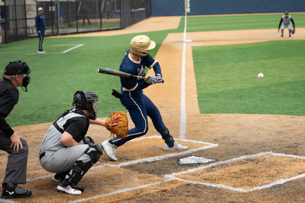 A batter lines up for a swing during the game against Towson.
