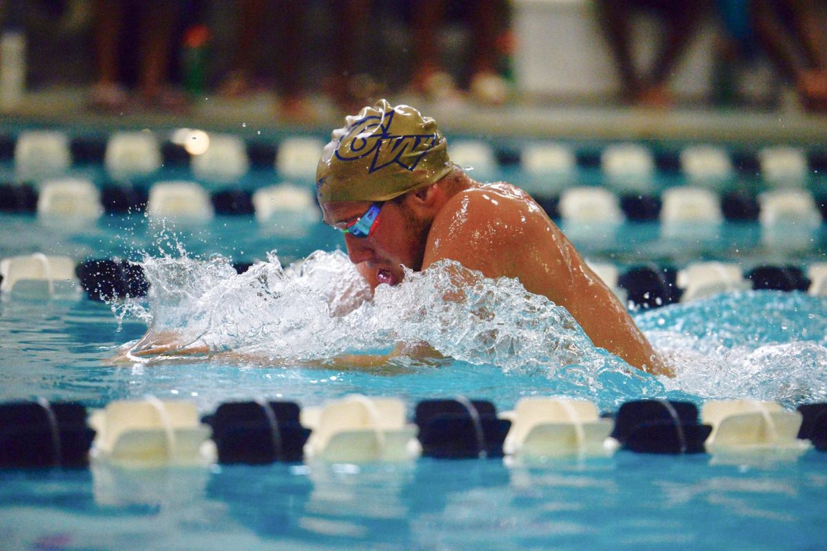 A swimmer slices through the water during a meet.