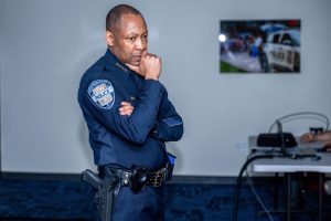 Chief of Police James Tate stands in the dark basement of Rome Hall, which houses GW’s virtual training simulator.