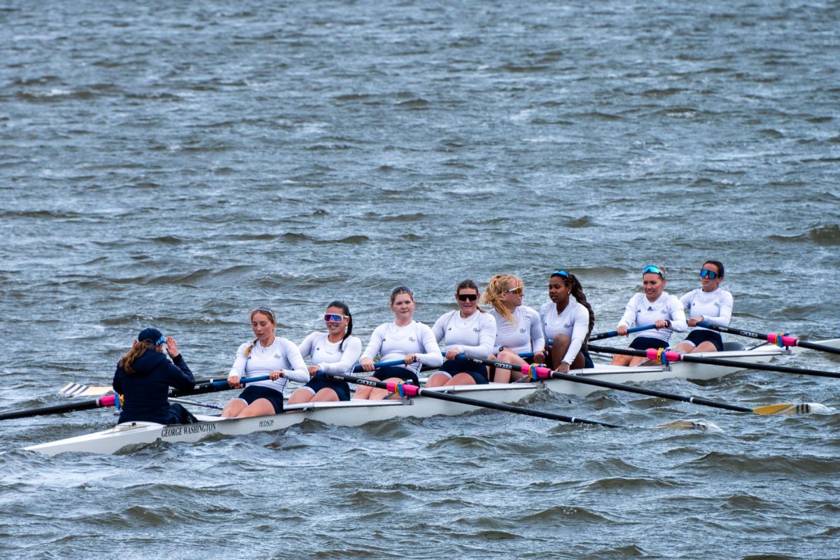 GW rowers coast across the Potomac River during the GW Invitational on Saturday morning.