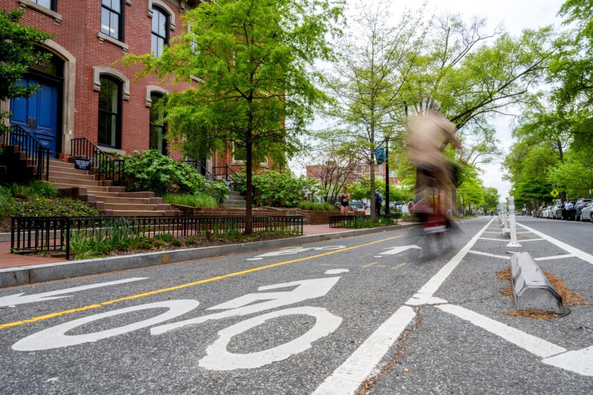 A cyclist whizzes down a bike lane on G Street.