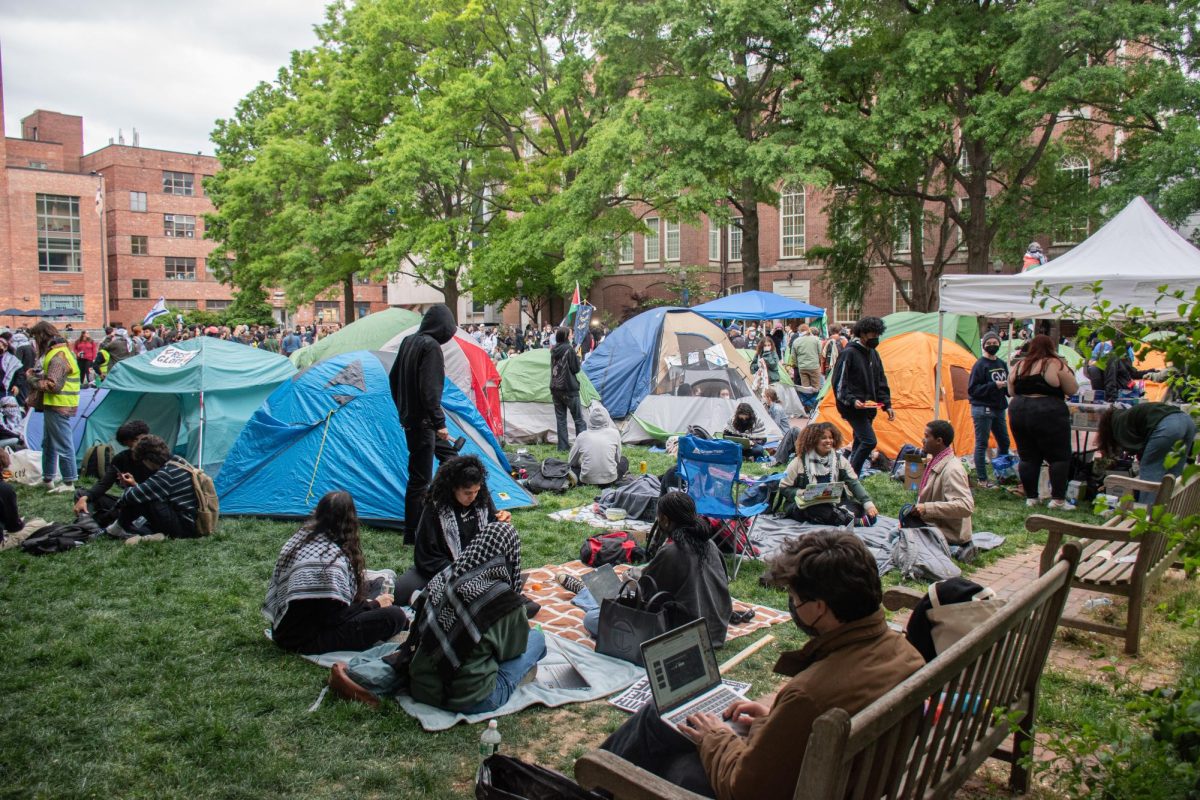 Students gather at the encampment in University Yard during the first day of protest Thursday.