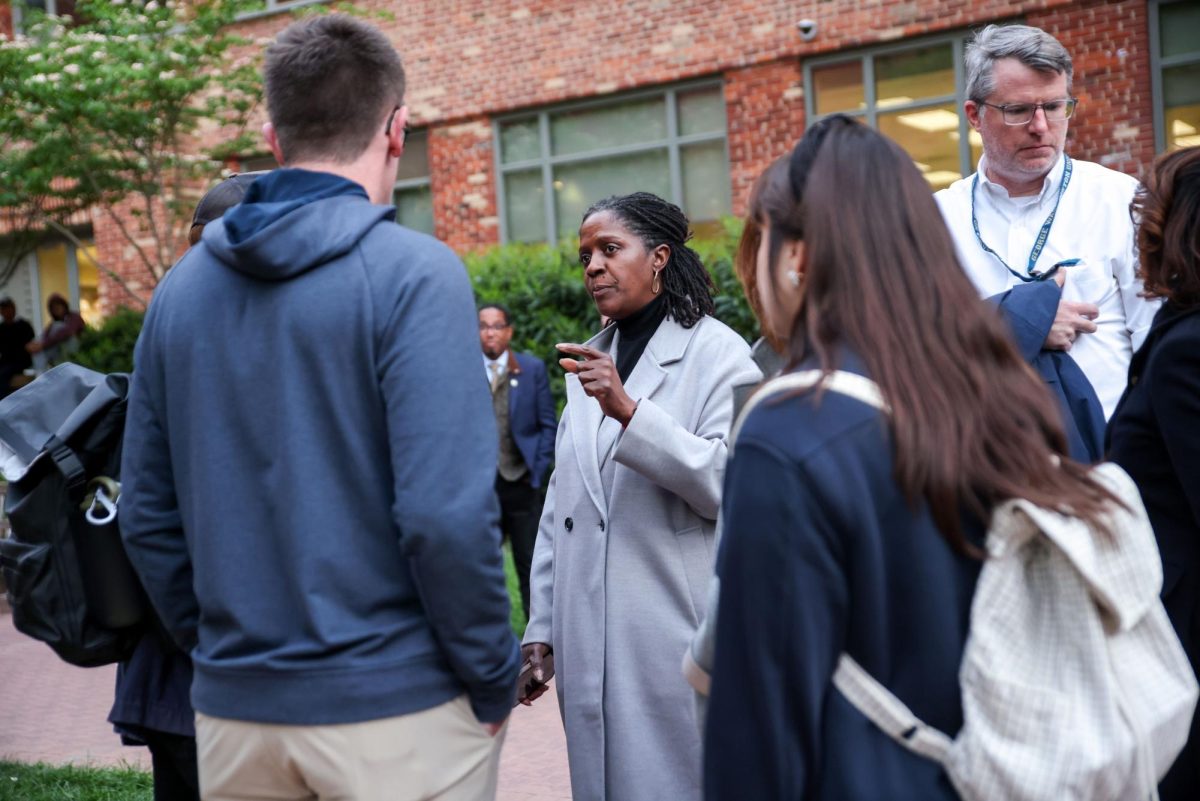 Dean of Students Colette Coleman speaks with students at the University Yard encampment last month.