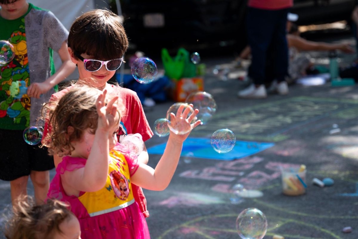 Kids played with bubbles and enjoyed the sunny day on H Street where protestors had set up tents adjacent to the University Yard Encampment. 