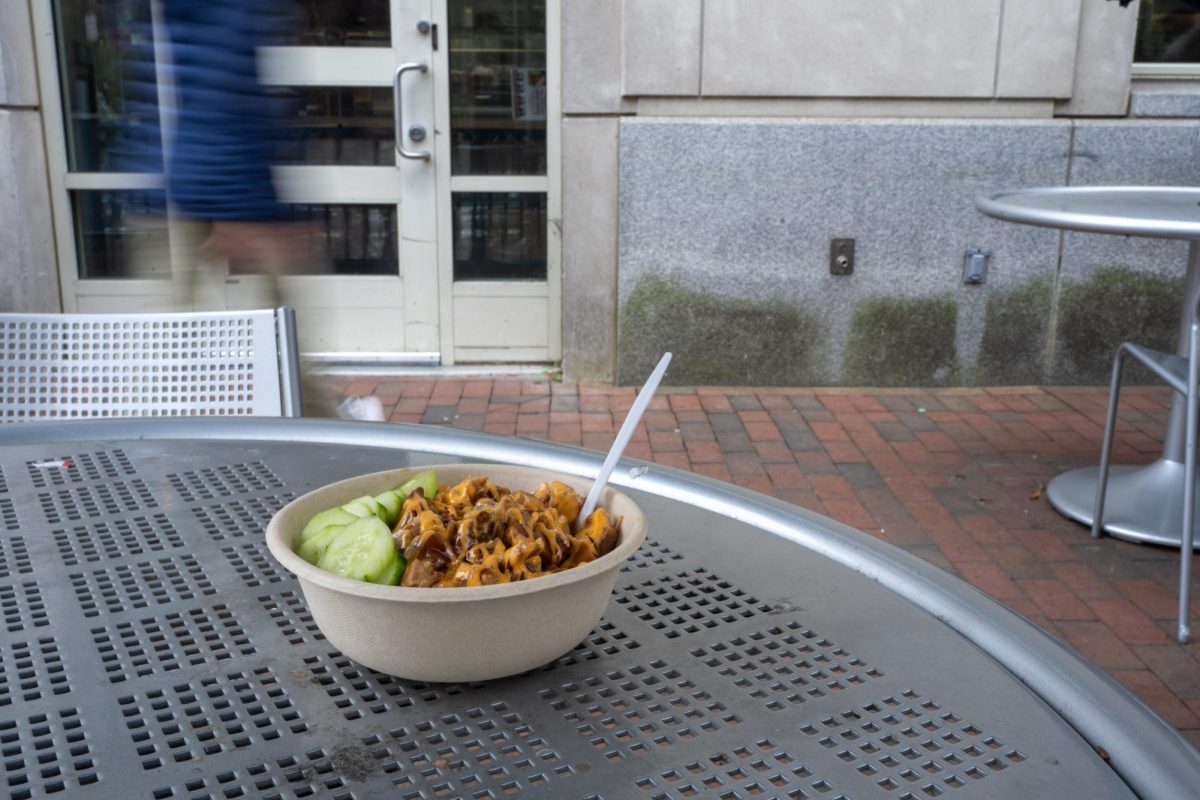 Sushi Do's chicken teriyaki bowl sits on a table outside Shenkman Hall.