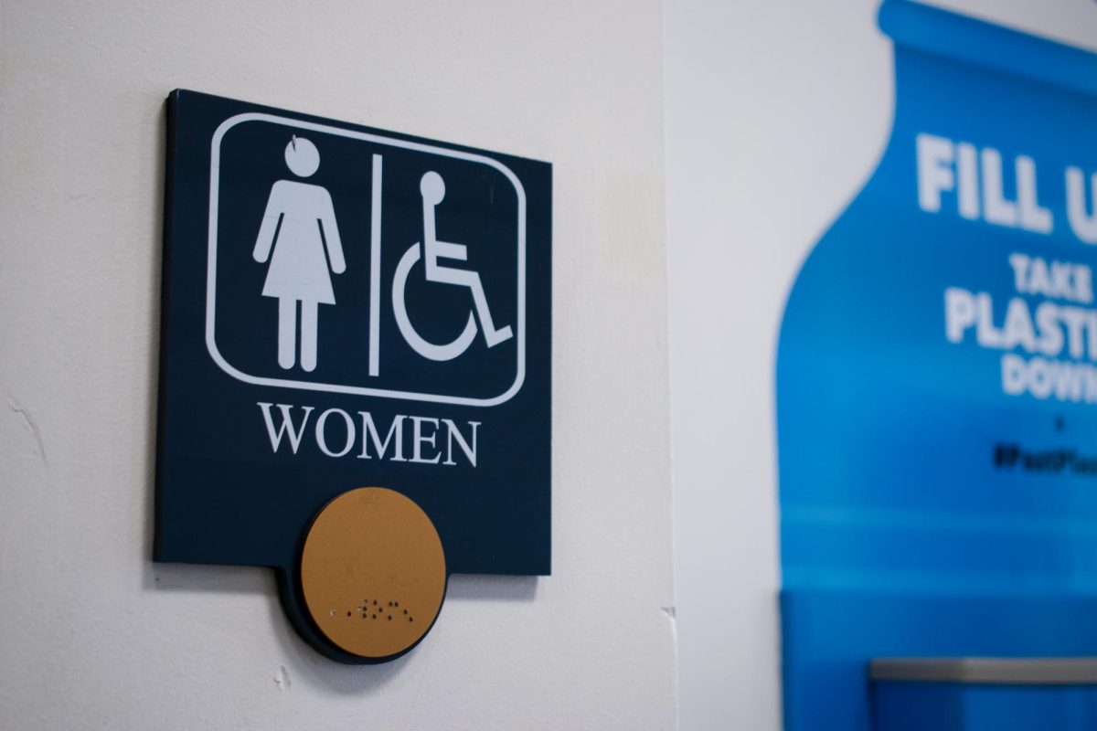 A braille sign for a womens bathroom.