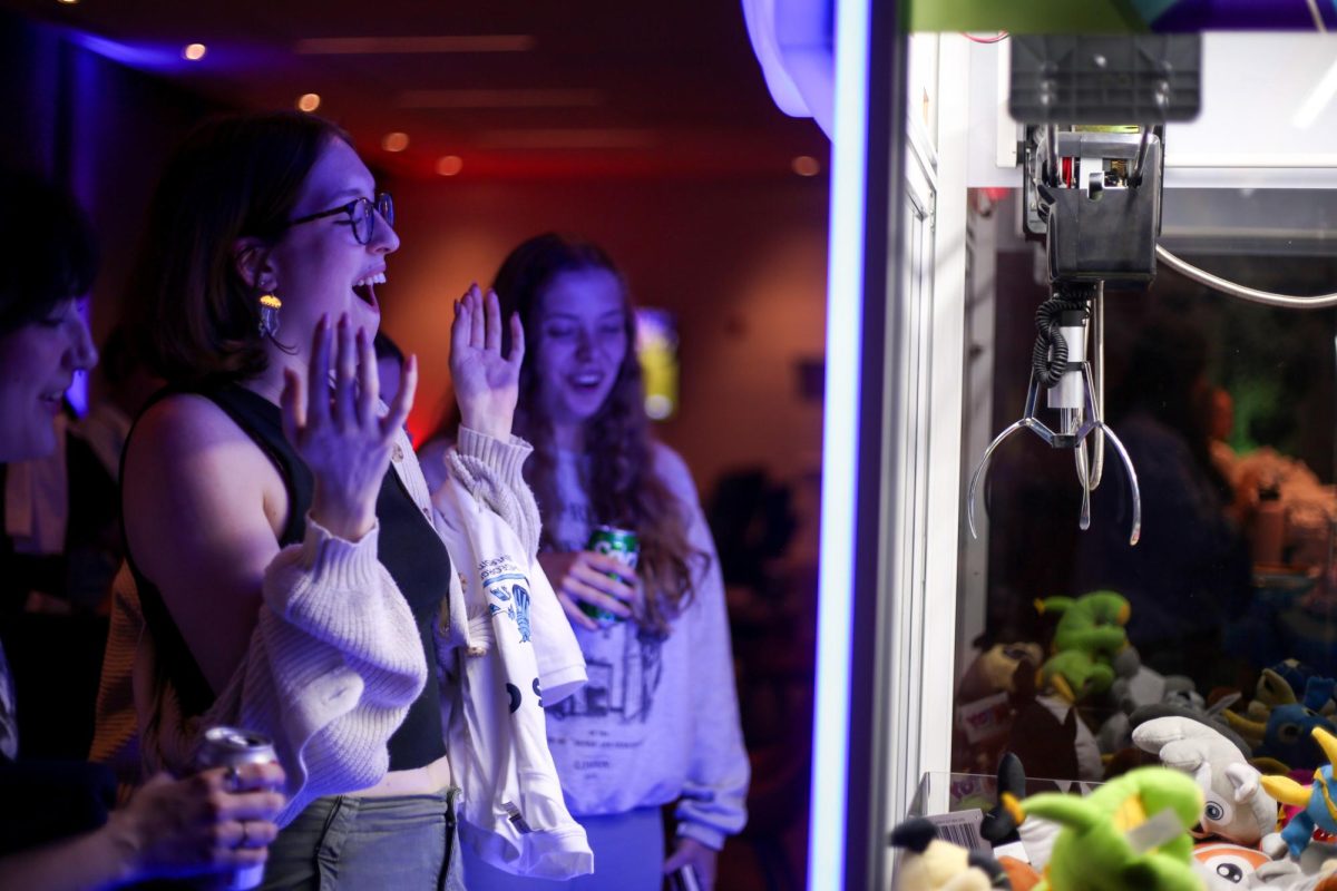 A graduating senior reacts to loosing their prize in the claw machine as part of the Last Night celebration.