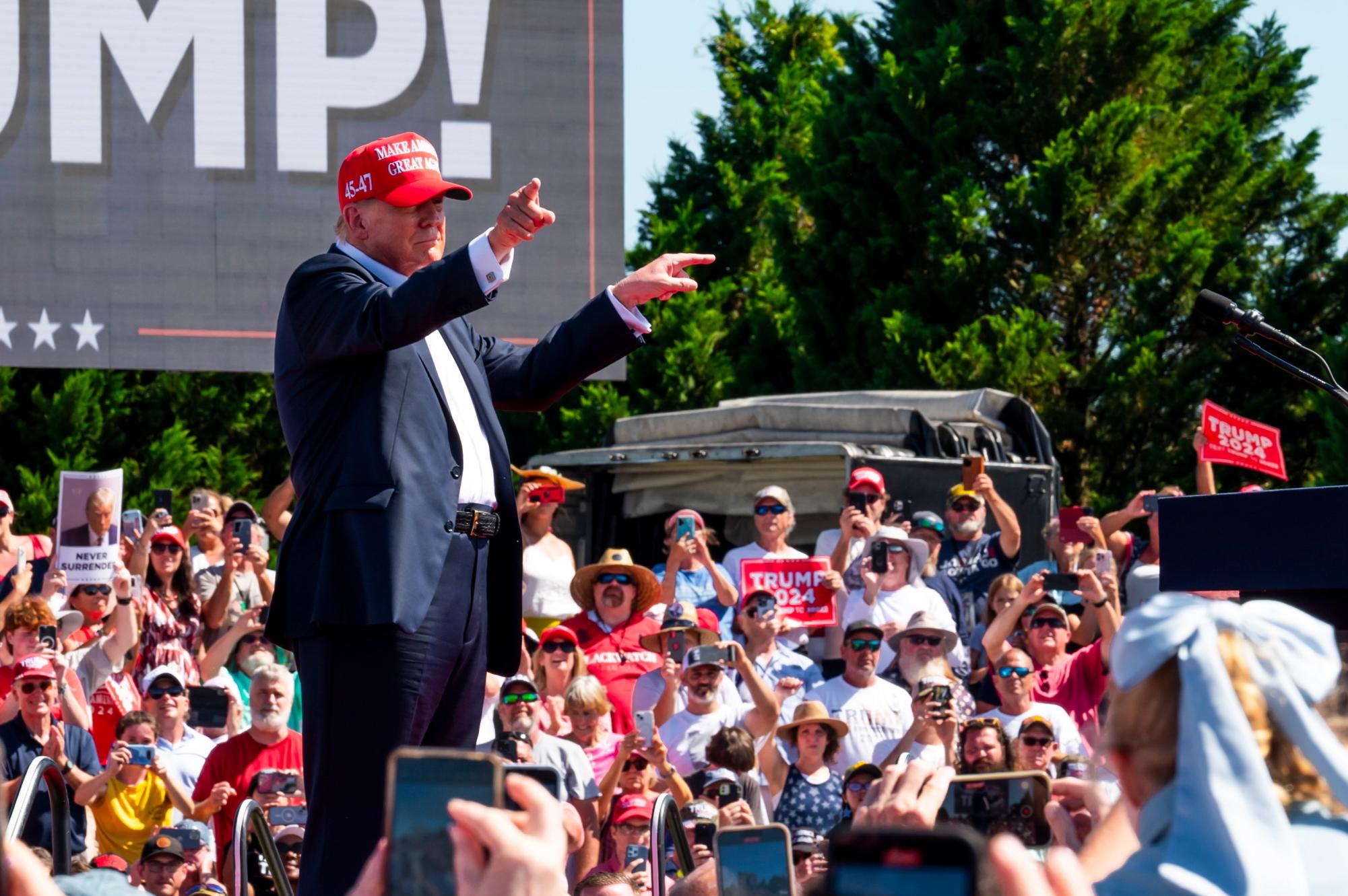 Former President Donald Trump points out to the crowd during his speech at a rally in Chesapeake, Virginia.