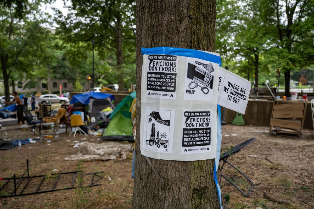 Signs were posted on the trees near the encampment clearing line, protesting the sweep.