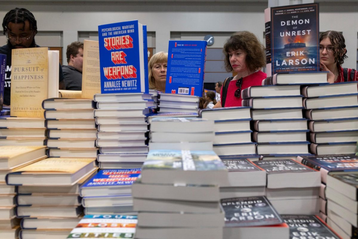 Convention attendees browse books for sale at the festival.