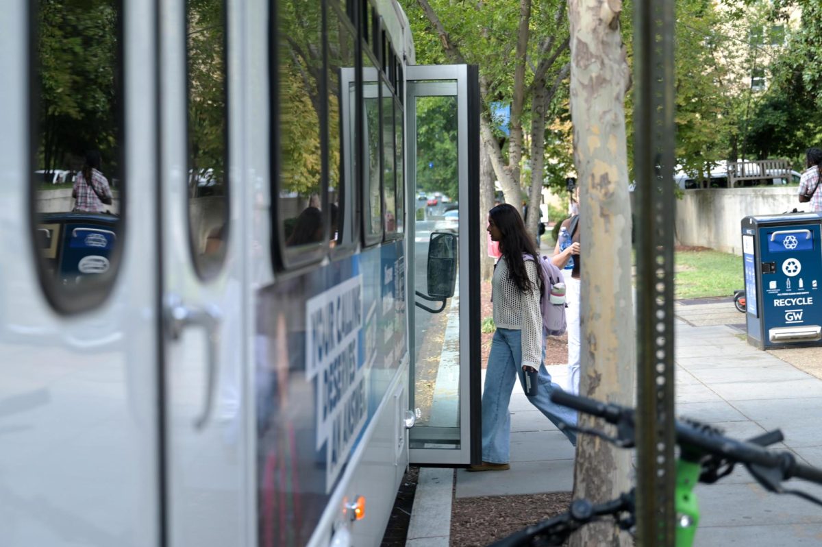 Students board the Mount Vernon Campus Express from the Tompkins Hall stop.