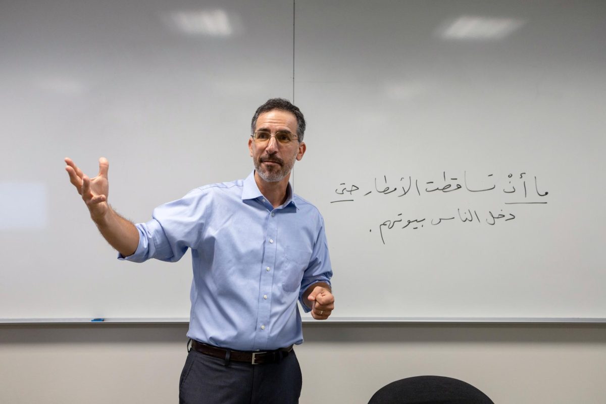 Teaching associate professor Ned Lazarus speaks during the opening of his Israeli-Palestinian Peacebuilding class.