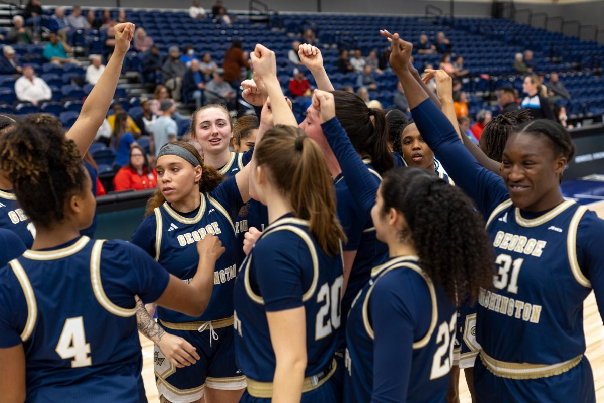 Members of the Women's Basketball team break from a huddle before their Atlantic-10 Championship game in March.