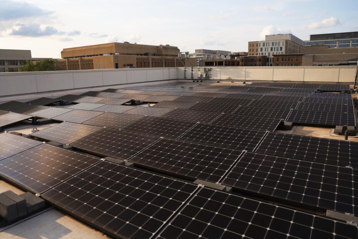 Solar panels line the roof of Monroe Hall.