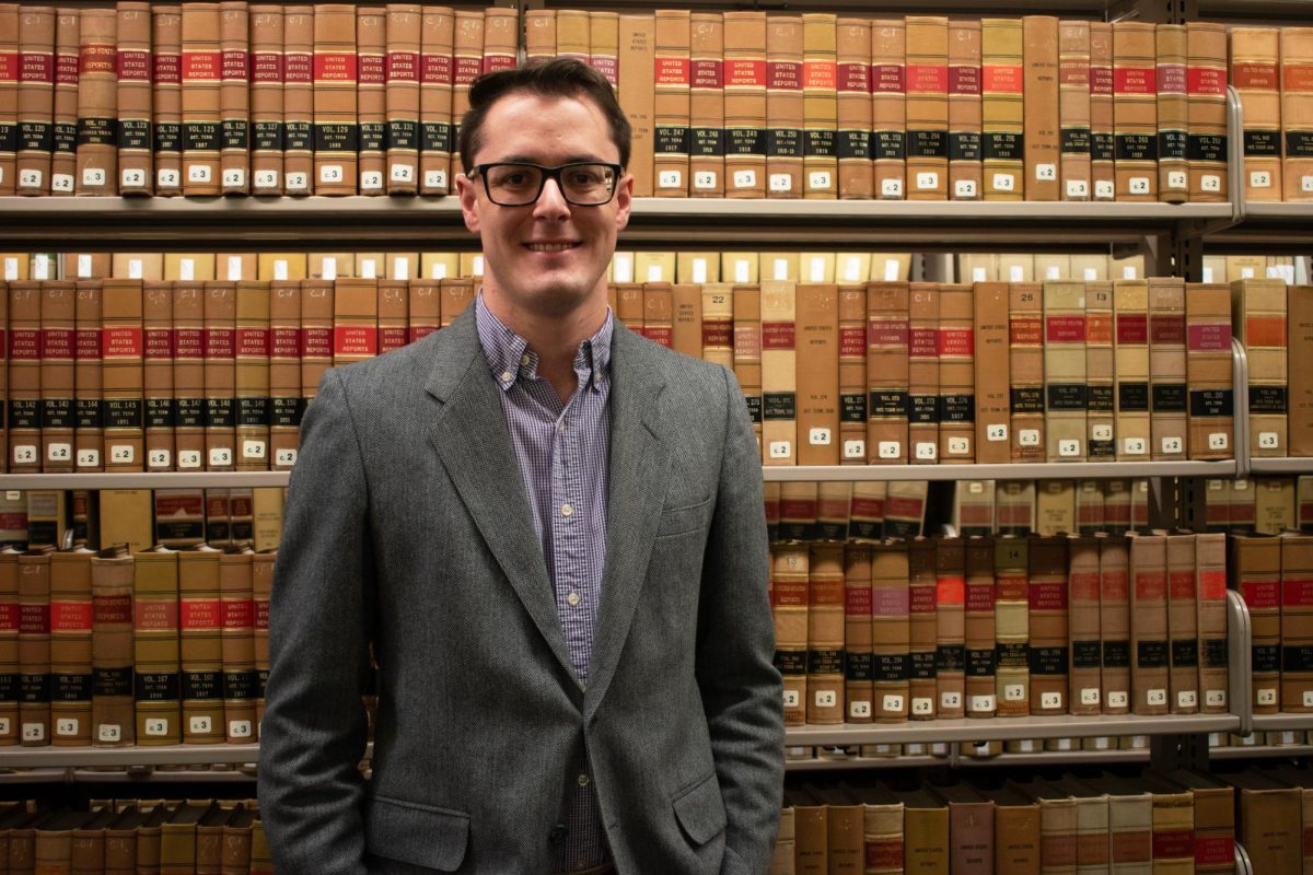 Nota Bene Editor-in-Chief Connor J. Toth poses for a portrait in the Jacob Burns Law Library.