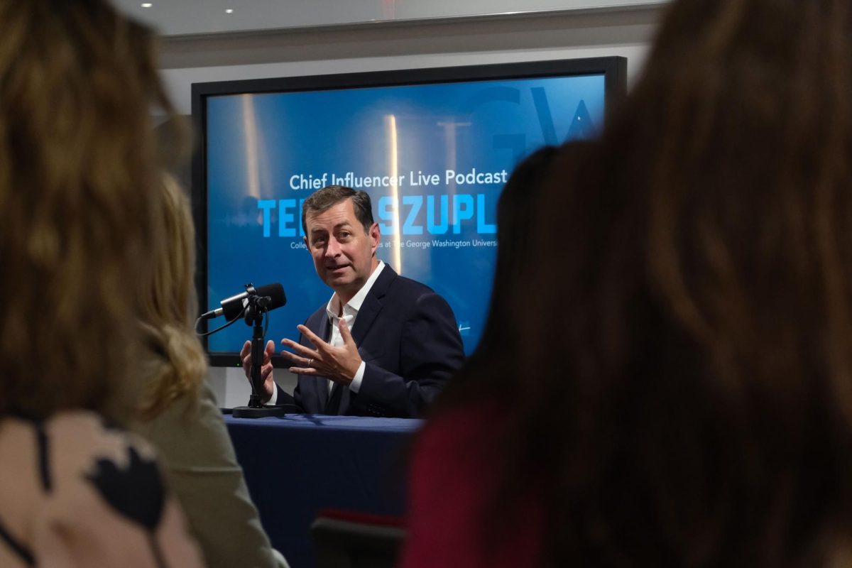 Obama Speechwriter Terry Szuplat speaks to the audience about his process for creating a speech.