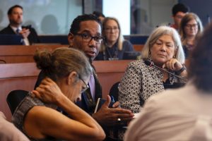 Provost Chris Bracey speaks to Ilana Feldman during the September Faculty Senate meeting.