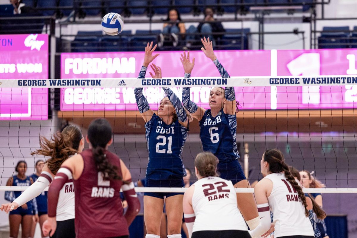 Sophomore outside hitter Haylee Brown and junior middle blocker Cianna Tejada spike the ball during a game against Fordham on Saturday.