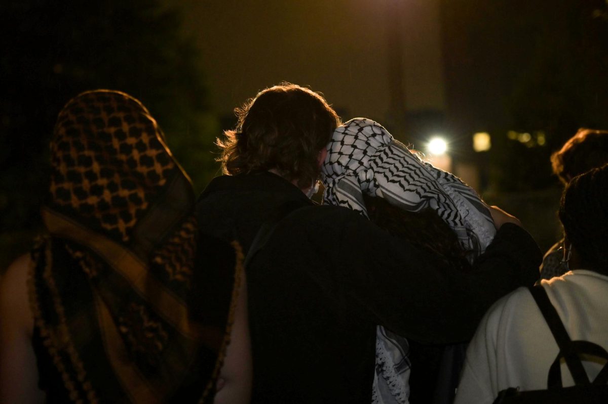 Two students embrace at a vigil last week honoring Palestinian and Lebanese people killed by the Israeli military.