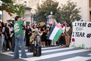 A demonstrator speaks after students walked out of class, protesting the war in Gaza.