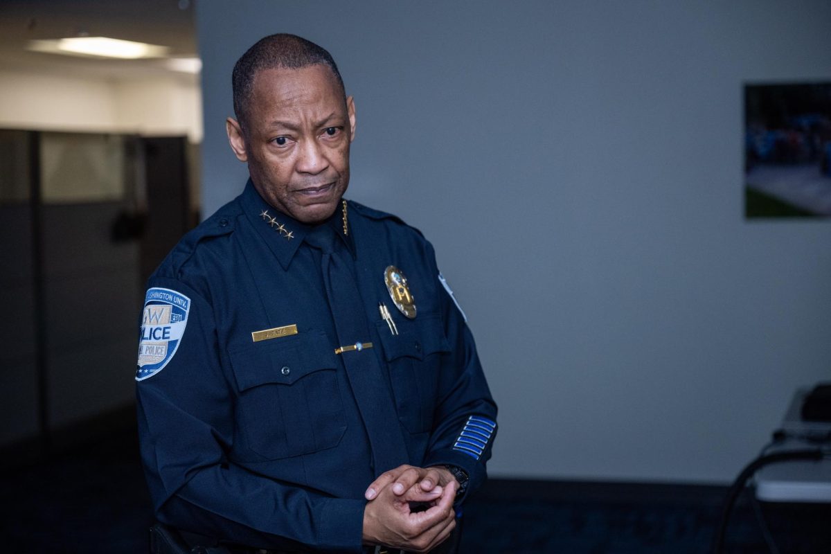 Former GW Police Department Chief James Tate pauses during a demonstration of the department’s firearms training. 