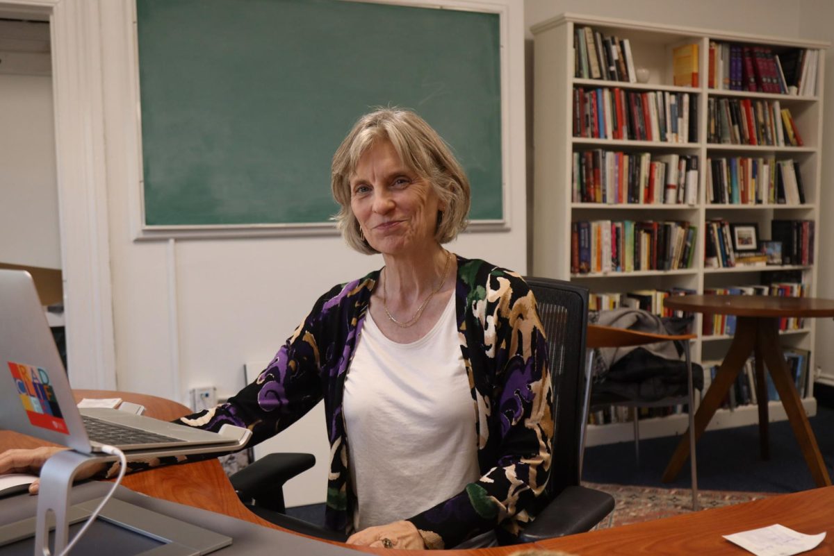 Program director and professor of American studies Melani McAlister sits at her desk for a portrait.