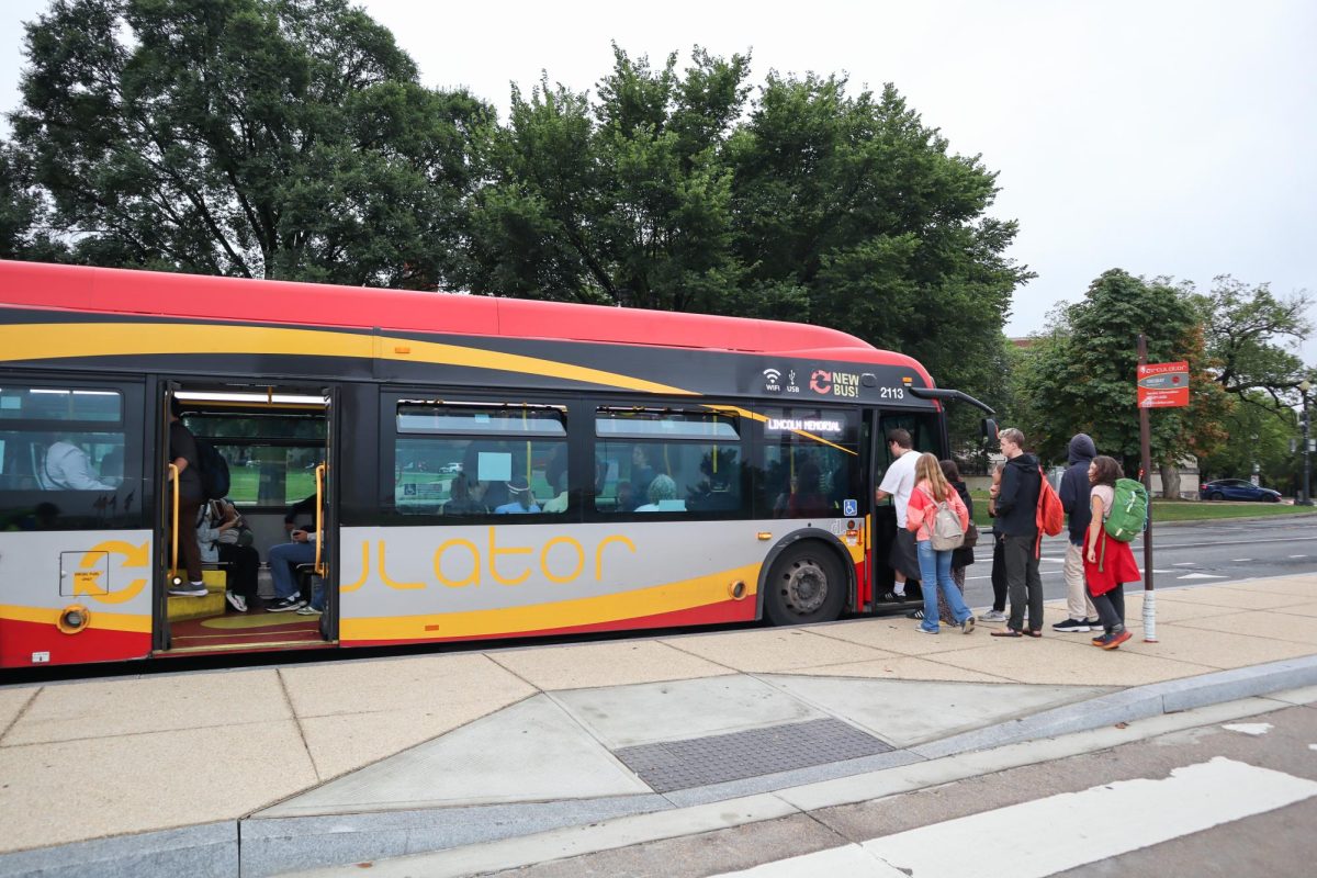 People board the Circulator bus at 15th Street and Jefferson Drive.