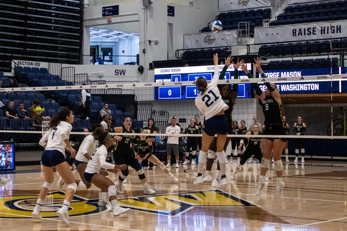 Sophomore outside hitter Haylee Brown spikes the ball during a game against George Mason.