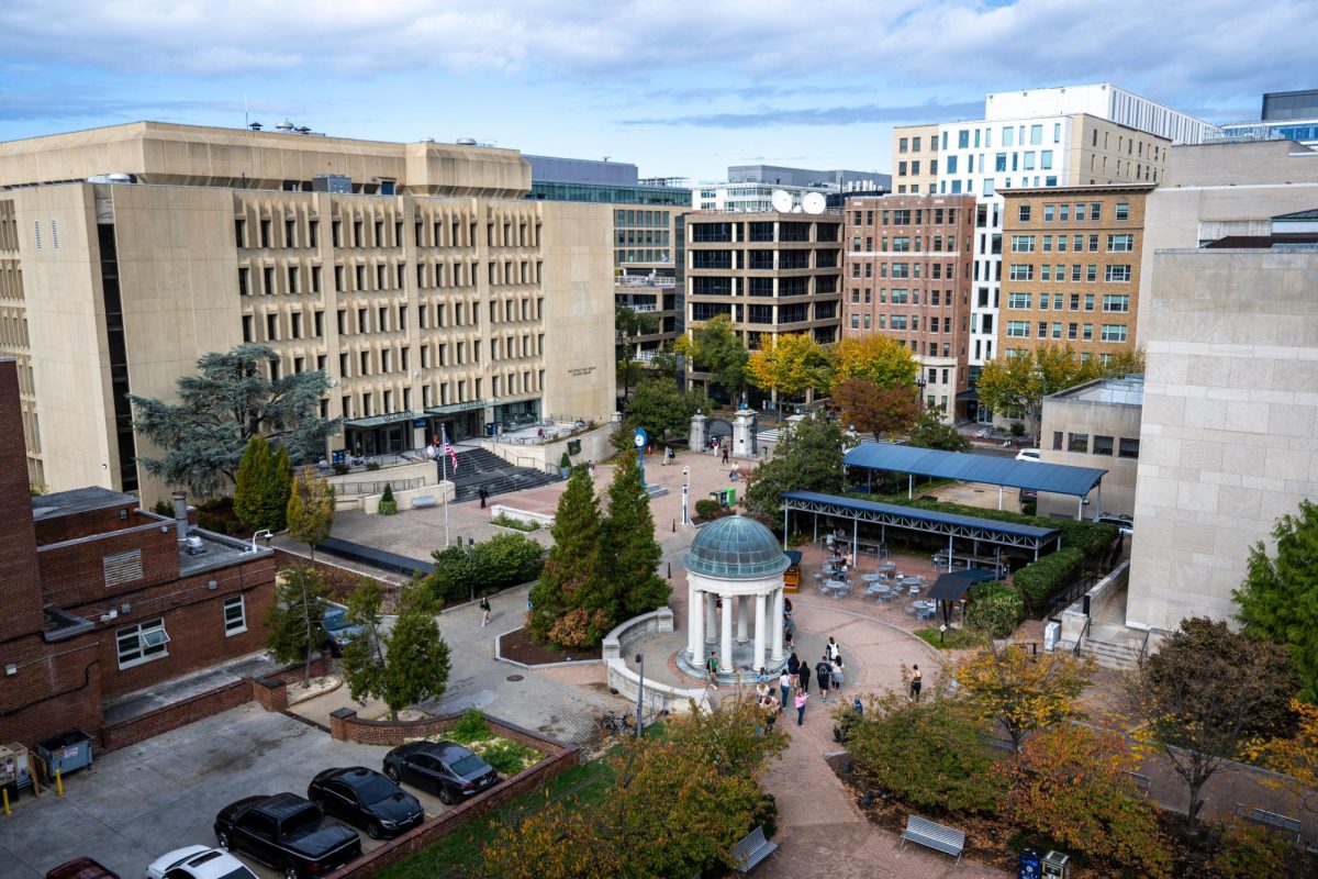 Students study and walk through Kogan Plaza.