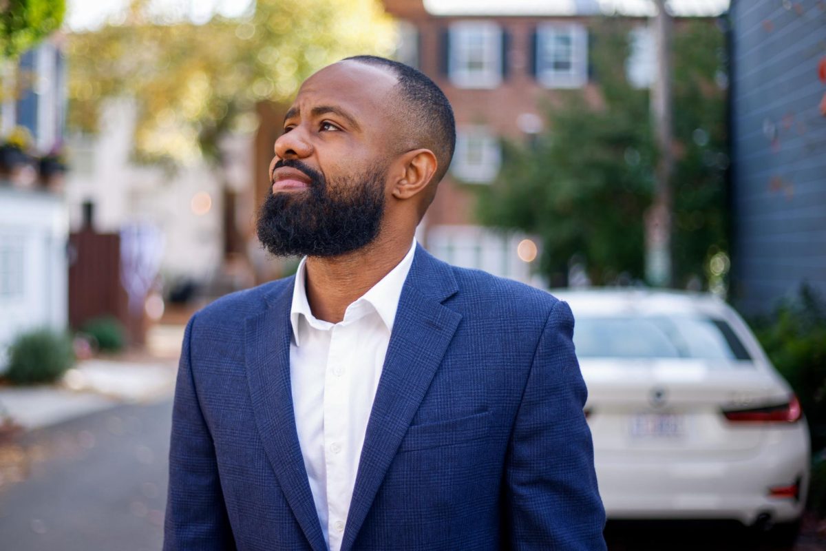 Rondell "Magic" Jordan poses for a portrait in Georgetown's Poplar Alley, which he cites as the "birthplace of gentrification."