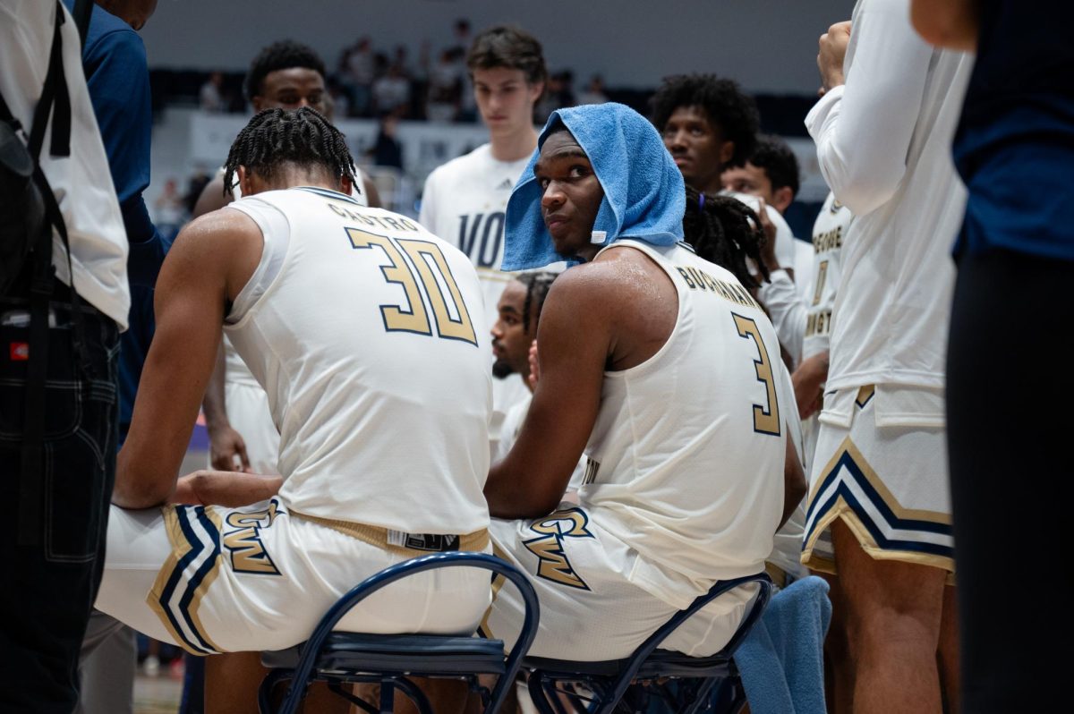 Redshirt sophomore forward Darren Buchanan Jr. sits in a team huddle during a game against Mercyhurst.