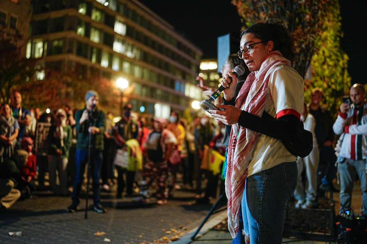 Protestors speak in front of the White House on 16th Street.