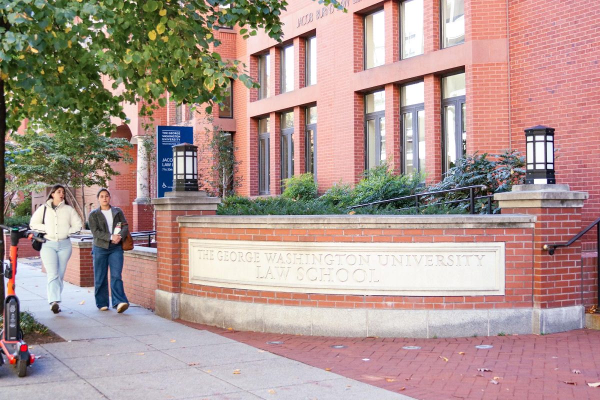 Students walk past the Law School.